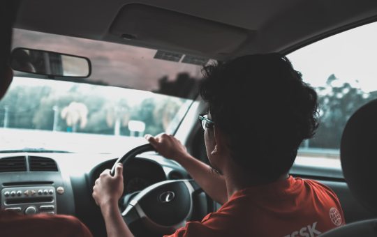 man driving car