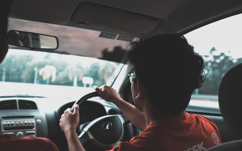 man driving car