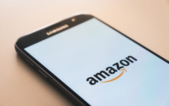 black Samsung Galaxy smartphone displaying Amazon logo
